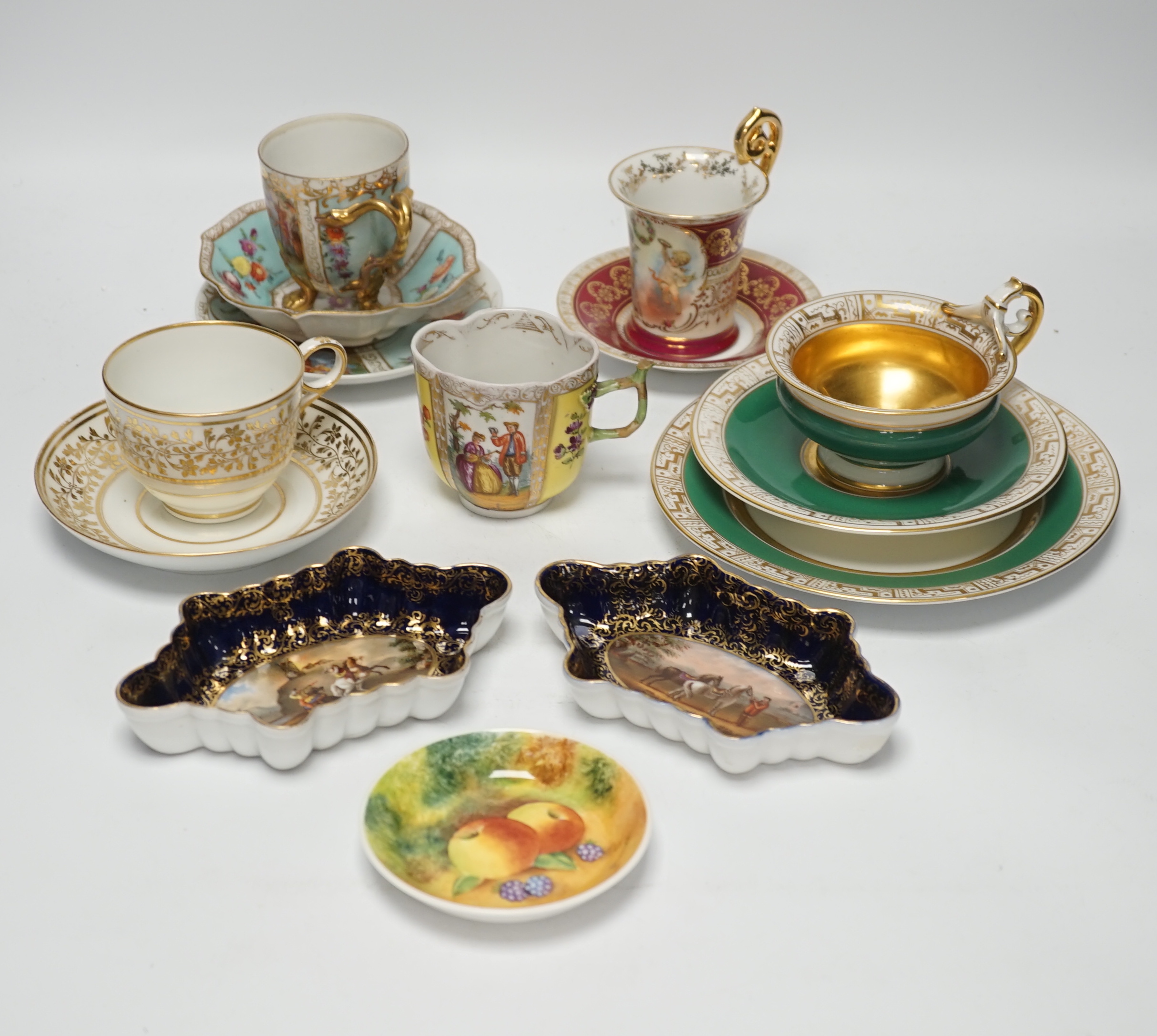 An Austrian chocolate cup and saucer, a similar trio, a BFB Worcester cup and saucer, a pair of spoon trays, etc. , spoon trays 15.5cm wide (14)